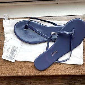 Brand new Tkees flip flop. Color glosses blackberry size 7